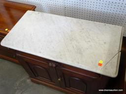 (ROW 2) VICTORIAN MARBLE TOP WASHSTAND WITH 1 DRAWER OVER 2 DOORS (DRAWER HAS A CARVED HANDLE).