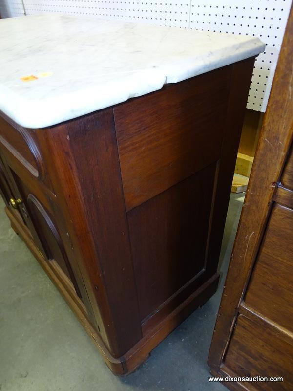 (ROW 2) VICTORIAN MARBLE TOP WASHSTAND WITH 1 DRAWER OVER 2 DOORS (DRAWER HAS A CARVED HANDLE).