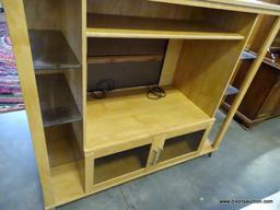 (ROW 2) MAPLE ENTERTAINMENT CENTER WITH 1 CENTER SHELF, 2 CENTER DOORS, AND 4 GLASS SHELVES ON