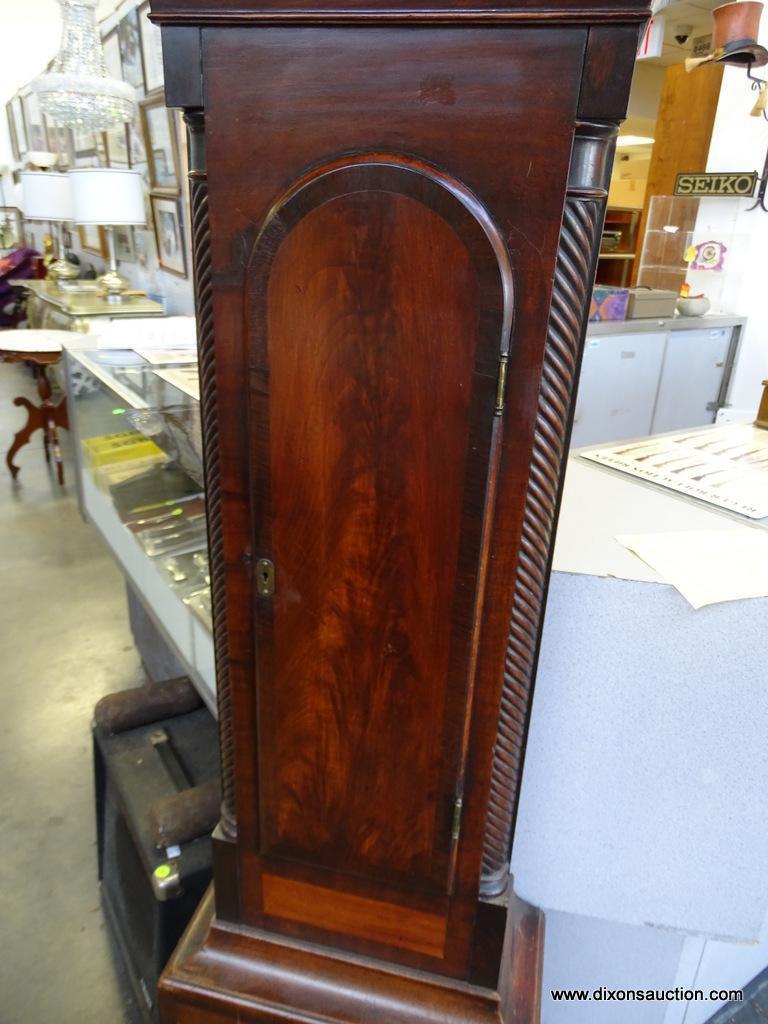 (FRONT, ROW 2) Antique Chippendale tall case clock with bracket feet. with the original weights and