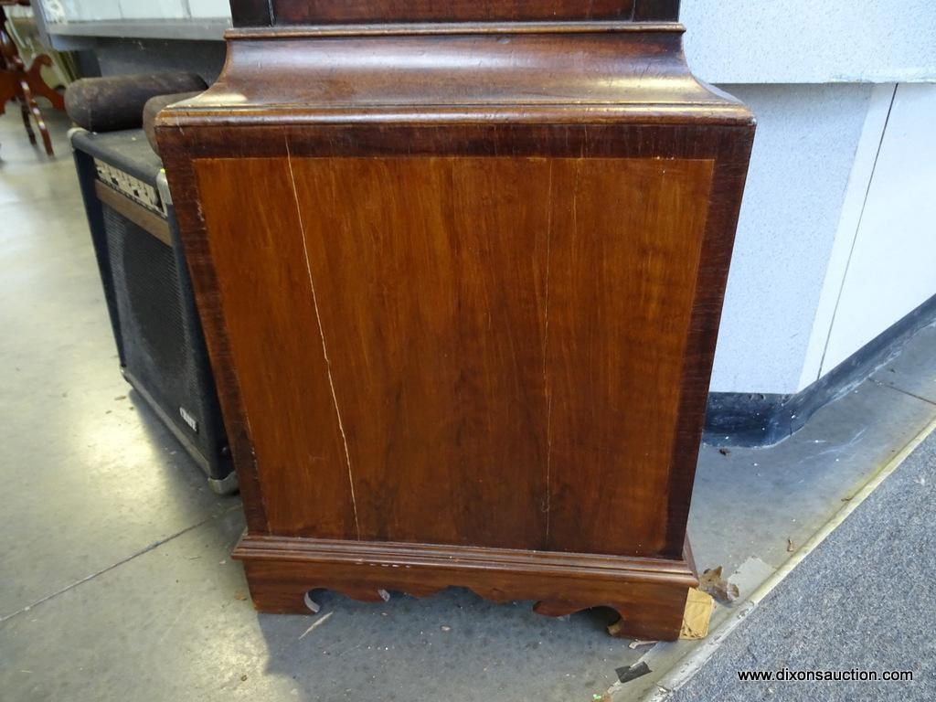 (FRONT, ROW 2) Antique Chippendale tall case clock with bracket feet. with the original weights and