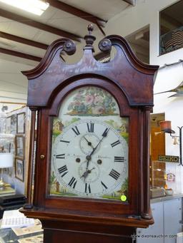 (FRONT, ROW 2) Antique Chippendale tall case clock with bracket feet. with the original weights and