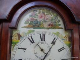 (FRONT, ROW 2) Antique Chippendale tall case clock with bracket feet. with the original weights and