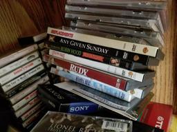 (LR CAB L) LOT OF ASSORTED VHS TAPES, CASSETTE TAPES, COMPACT DISCS, AND DVD'S, POPULAR TITLES OF