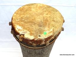 DRUM, MUSIMBO, CIRCULAR HOLLOWED OUT HARD WOOD DRUM WITH THE TOP IMPALED WITH SKIN USING PEGS THAT