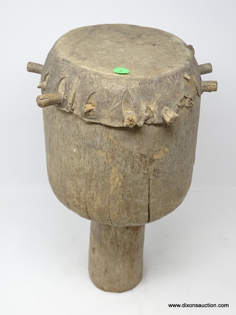 DRUM, BADIMA BUNTIBE, CIRCULAR HOLLOWED OUT HARD WOOD IMPALED WITH ANIMAL SKIN USING WOODEN PEGS