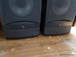 (R1) PAIR OF INFINITY SPEAKERS. MODEL RS3. IN BLACK WOOD GRAINED CASES. ONE IS MISSING THE PLASTIC