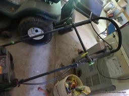 (SHED 1) LAWN-BOY PUSH MOWER. SERIAL #250003069. HAS BAGGER ATTACHMENT.