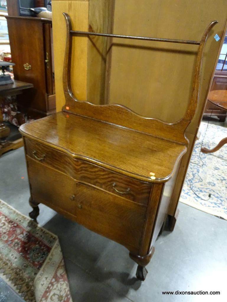 (R3) ANTIQUE BALL AND CLAW-FOOT TIGER OAK WASHSTAND WITH 1 DRAWER OVER 2 DOORS AND A TOWEL BAR.