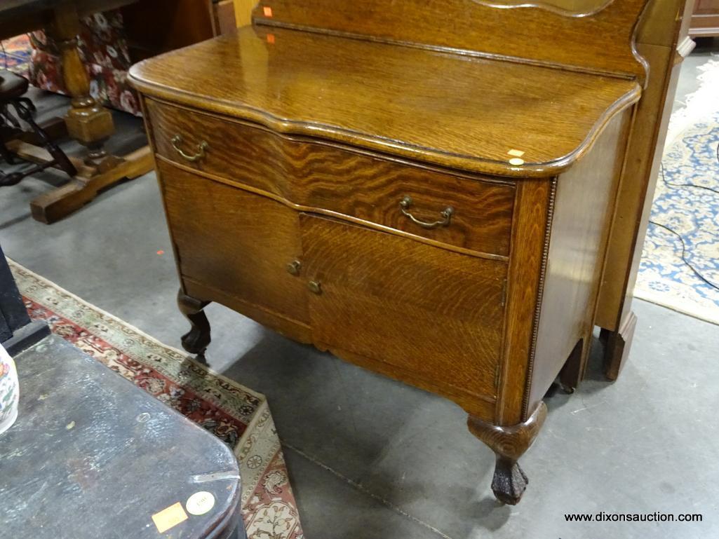 (R3) ANTIQUE BALL AND CLAW-FOOT TIGER OAK WASHSTAND WITH 1 DRAWER OVER 2 DOORS AND A TOWEL BAR.