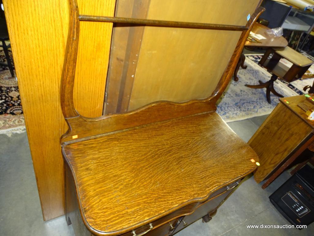 (R3) ANTIQUE BALL AND CLAW-FOOT TIGER OAK WASHSTAND WITH 1 DRAWER OVER 2 DOORS AND A TOWEL BAR.