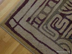 (LR) AREA RUG; TAN WITH BROWN/OLIVE GREEN ACCENTS IN A CIRCULAR/GRECIAN PATTERN. NOT FRINGED, FAIRLY