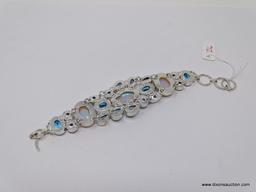 VERY ATTRACTIVE HANDMADE SILVERTONE BRACELET WITH GEMSTONES. TOGGLE CLASP. MEASURES 8.5 IN