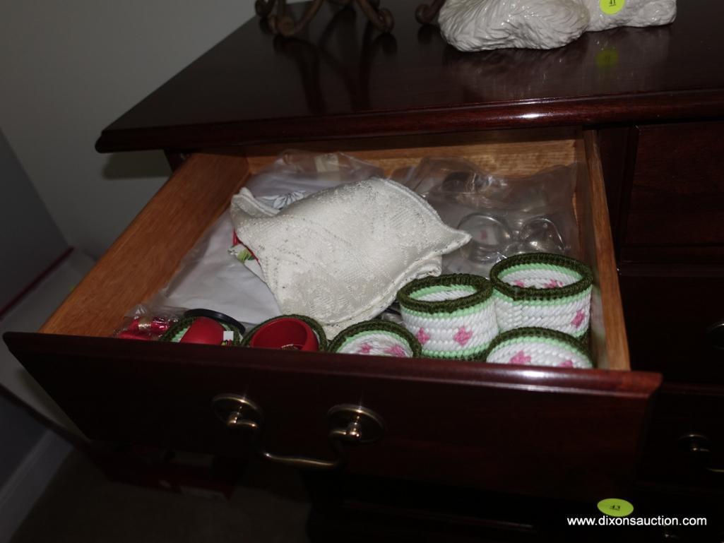 (BR2) CONTENTS OF LEFT SIDE OF SIDEBOARD: NAPKIN RINGS, DOILIES, STRING, ETC