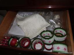 (BR2) CONTENTS OF LEFT SIDE OF SIDEBOARD: NAPKIN RINGS, DOILIES, STRING, ETC