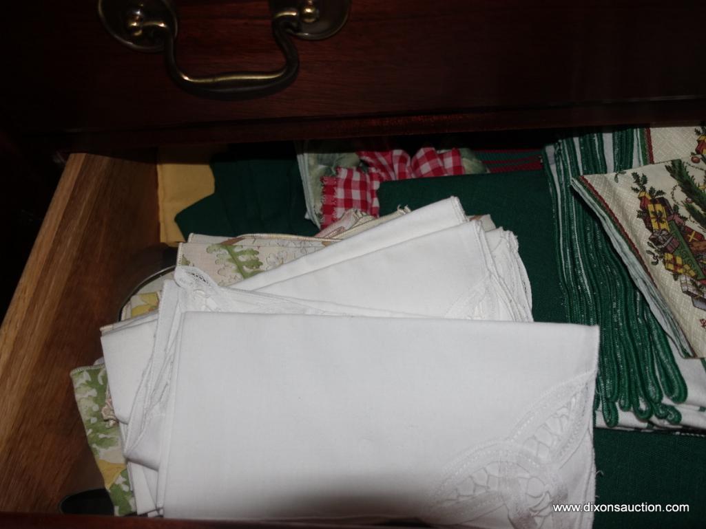 (BR2) CONTENTS OF LOWER CENTER OF SIDEBOARD: NAPKINS, PLACEMATS, TOWELS, ETC