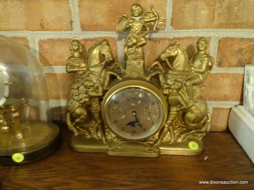 (LR) HERMIE "ROMANCE" SHELF/ MANTEL CLOCK; CASE HAS ROMAN FIGURES ON HORSEBACK WITH A CHERUB ATOP