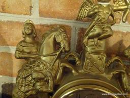 (LR) HERMIE "ROMANCE" SHELF/ MANTEL CLOCK; CASE HAS ROMAN FIGURES ON HORSEBACK WITH A CHERUB ATOP