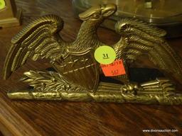 (LR) BRASS FEDERAL EAGLE AND SHIELD BOOKENDS; PAIR SITTING ON MANTLE. EACH MEASURES ABOUT 9" LONG.