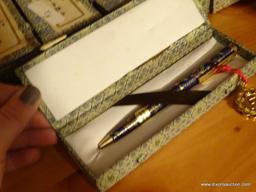 (LR) 15 CLOISONNE WRITING PENS IN CHINESE PATTERNED BOXES. LOCATED ON SHELF IN DOUBLE BOOKCASE IN