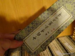 (LR) 15 CLOISONNE WRITING PENS IN CHINESE PATTERNED BOXES. LOCATED ON SHELF IN DOUBLE BOOKCASE IN