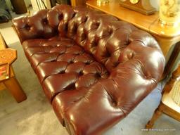 (LR) SMALL LEATHER COUCH; BUTTON-TUFTED CHOCOLATE BROWN LEATHER IS IN EXCELLENT CONDITION. ATTENTION