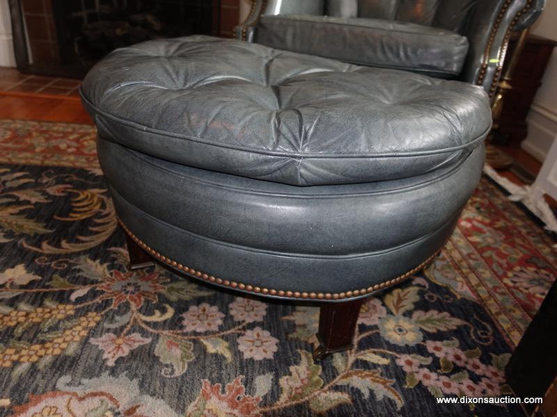 (LR) ONE OF A PAIR OF HANCOCK AND MOORE LEATHER ARM CHAIR WITH MATCHING OTTOMAN-CHAIR- 32"W X 24"L X