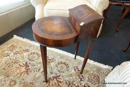(WIN) ROUND MAHOGANY SIDE TABLE WITH STORAGE TRAY; LEATHER TOOLED TOP, 4 TAPERING LEGS. ELEVATED TOP
