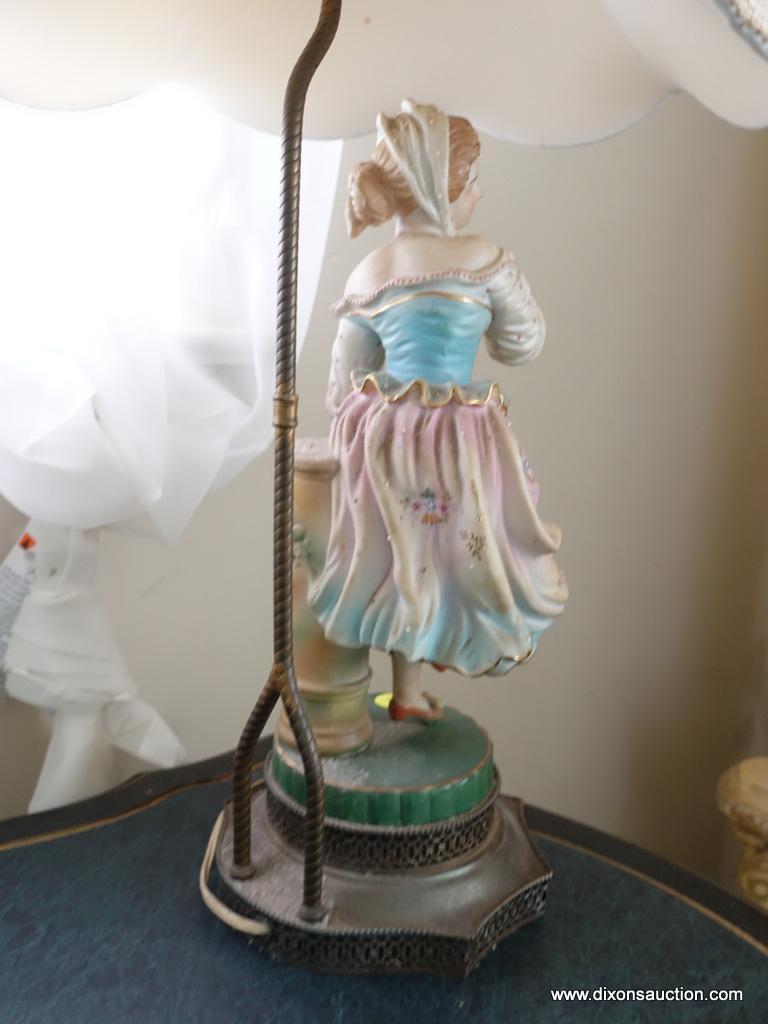 (BED) PORCELAIN VICTORIAN STATUE LAMP WITH LAMPSHADE; YOUNG MAIDEN IN PASTEL SHADES STANDING ON A