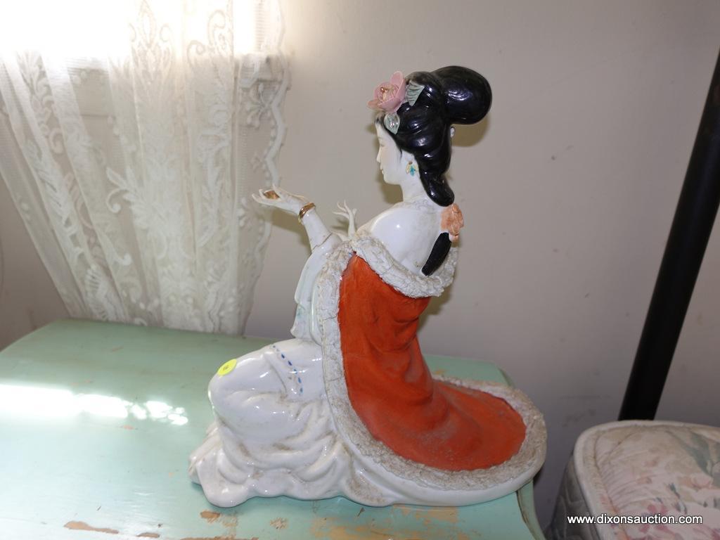 (BED) PORCELAIN GEISHA GIRL STATUE; VERY FORMALLY DRESSED WOMAN IN A KNEELING POSE. REDS AND PASTELS