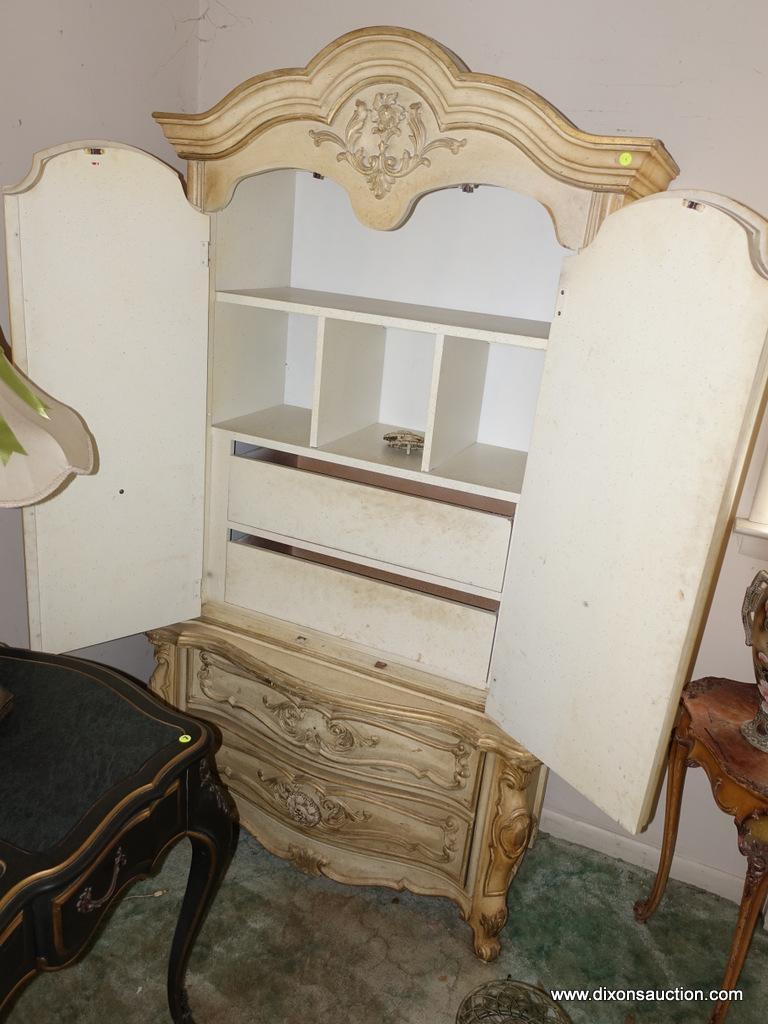 (BED) LIGHT YELLOW FRENCH PROVINCIAL ARMOIRE; MOLDED BONNET TOP WITH CARVED EMBLEM OVER 2 ARCHED