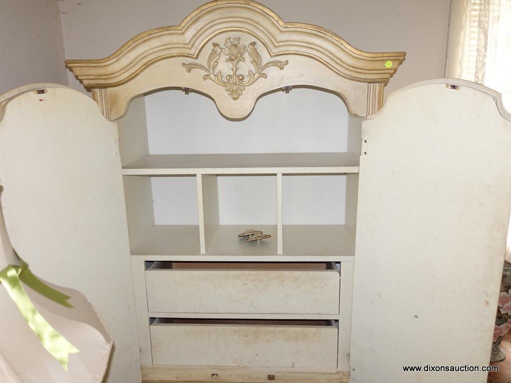 (BED) LIGHT YELLOW FRENCH PROVINCIAL ARMOIRE; MOLDED BONNET TOP WITH CARVED EMBLEM OVER 2 ARCHED