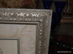 (LR) BRAND NEW FRAMED AND MATTED FLORAL PRINT IN SILVER TONED CARVED FRAME- SIGNED VIVIAN
