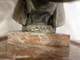 (DIS)ELEPHANT HEAD ON MARBLE PEDESTAL