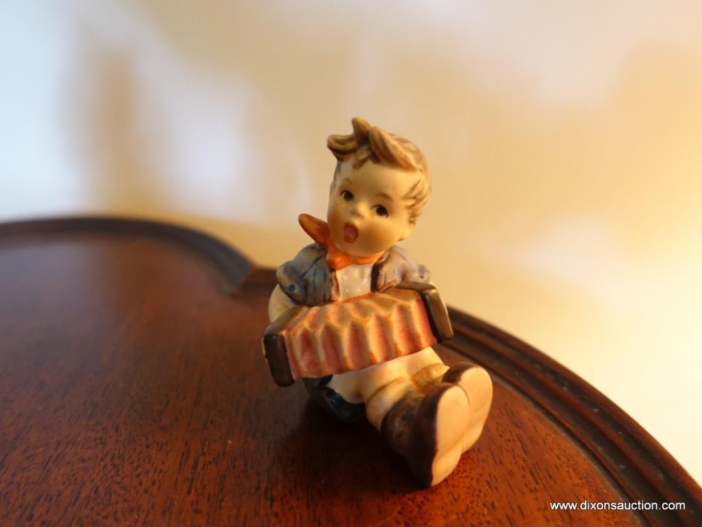 (LR) GOEBEL HUMMEL FIGURINE OF BOY PLAYING ACCORDIAN-3"H