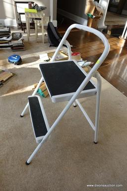 (MLR) WHITE/BLACK STEP STOOL; METAL WITH GRIPPING SURFACE ON STEPS, FOLDS FOR EASY STORAGE. STANDS