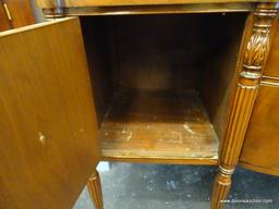 BERKEY AND GAY SIDEBOARD; FLAME MAHOGANY WITH A BOW FRONT DESIGN. SINGLE CENTER DRAWER FLANKED ON