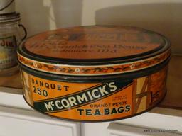 (KIT) 2 ANTIQUE ADVERTISING McCORMICK TEA TINS- 10" DIA. AND RECTANGULAR- 7"W X 4"L X 4"H