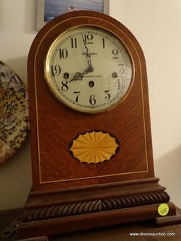 (UHAL) BALDWIN DOME TOP MANTLE CLOCK WITH WESTMINSTER CHIME AND METAL FACE. HAS BRASS HANDLES ON