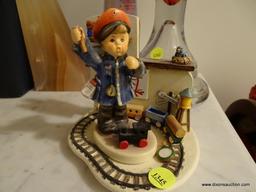 (UHAL) LOT OF 2 GOEBEL HUMMEL ITEMS: 1 FIRST ISSUE 2001 "ALL ABOARD" (SIGN IS DAMAGED BUT ALL PIECES