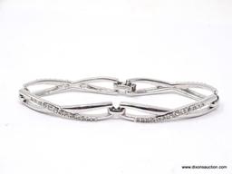 Beautiful Swarovski silver plated infinity design bracelet in mint condition. This has an awesome