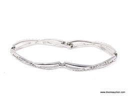 Beautiful Swarovski silver plated infinity design bracelet in mint condition. This has an awesome