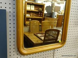 FRAMED MIRROR; MEDIUM SIZED MIRROR WITH ARCHED TOP. THIS MIRROR IS FRAMED IN A WOOD FRAME THAT HAS