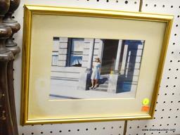 FRAMED PRINT; THIS IS A MATTED PRINT OF A WOMAN IN A WHITE SUNDRESS WITH A STRAW HAT STANDING ON A