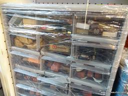 18-DRAWER STORAGE CHEST; FILLED WITH FIREARM PARTS AS WELL AS SOME AMMUNITION. CABINET IS GREY IN