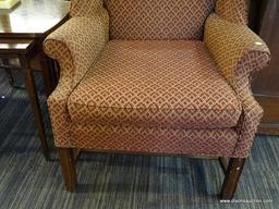MAROON WINGBACK CHAIR; 1 OF A PAIR OF FLAME STITCHED WINGBACK CHAIRS WITH MAHOGANY LEGS. FABRIC IS
