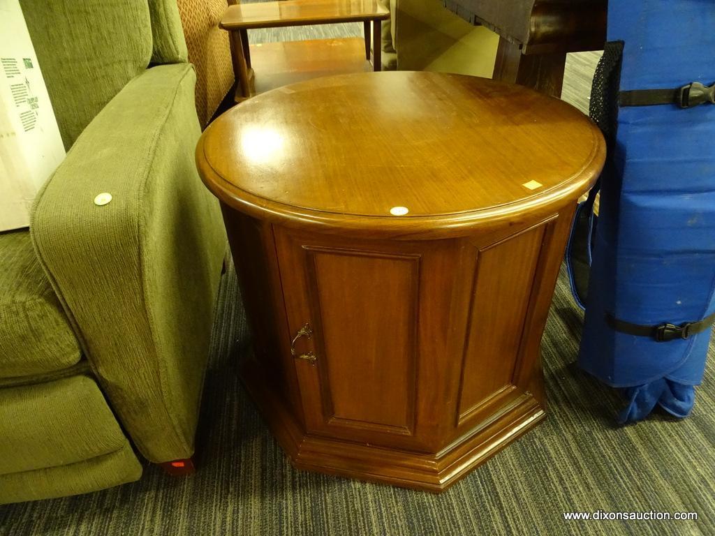 DRUM-SHAPED END TABLE/CABINET; ROUND TOP SURFACE WITH 8 PANELED SIDES BENEATH, 2 OF WHICH FORM A