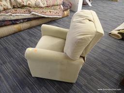 BEIGE CHILDS RECLINER; MAGNOLIA FURNITURE CHILDS RECLINER IN BEIGE. RETAIL VALUE $80. HAS SOME VERY