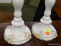 CANDLESTICK HOLDERS; PAIR OF VINTAGE ELEGANT WHITE PORCELAIN CANDLESTICKS WITH GOLD PAINTED ACCENTS.