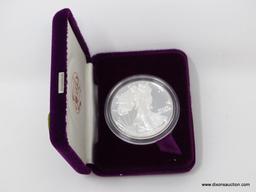 1987 AMERICAN EAGLE SILVER DOLLAR, UNCIRCULATED, IN PRESENTATION BOX